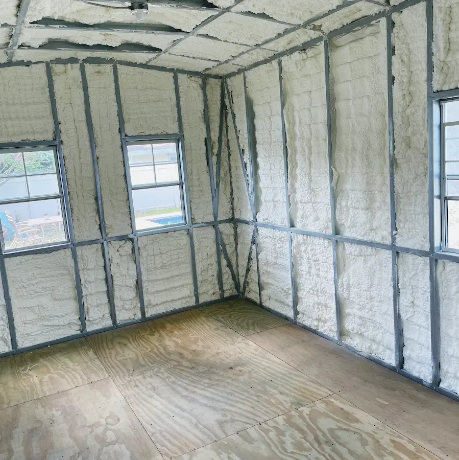 Closed-cell spray foam insulation applied to wall cavities in a residential project in Saginaw